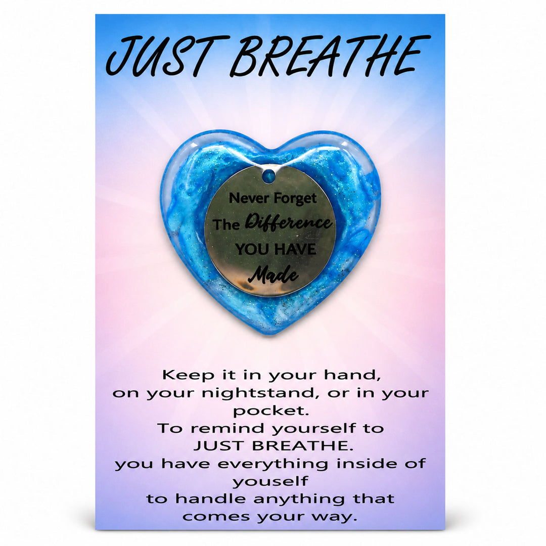 Blue heart-shaped pendant with motivational message on a gradient background