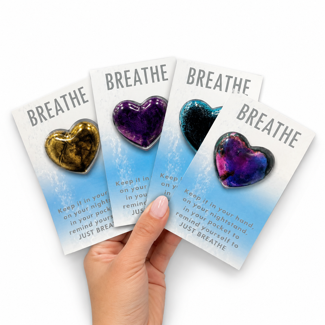 Hand holding breathe stones