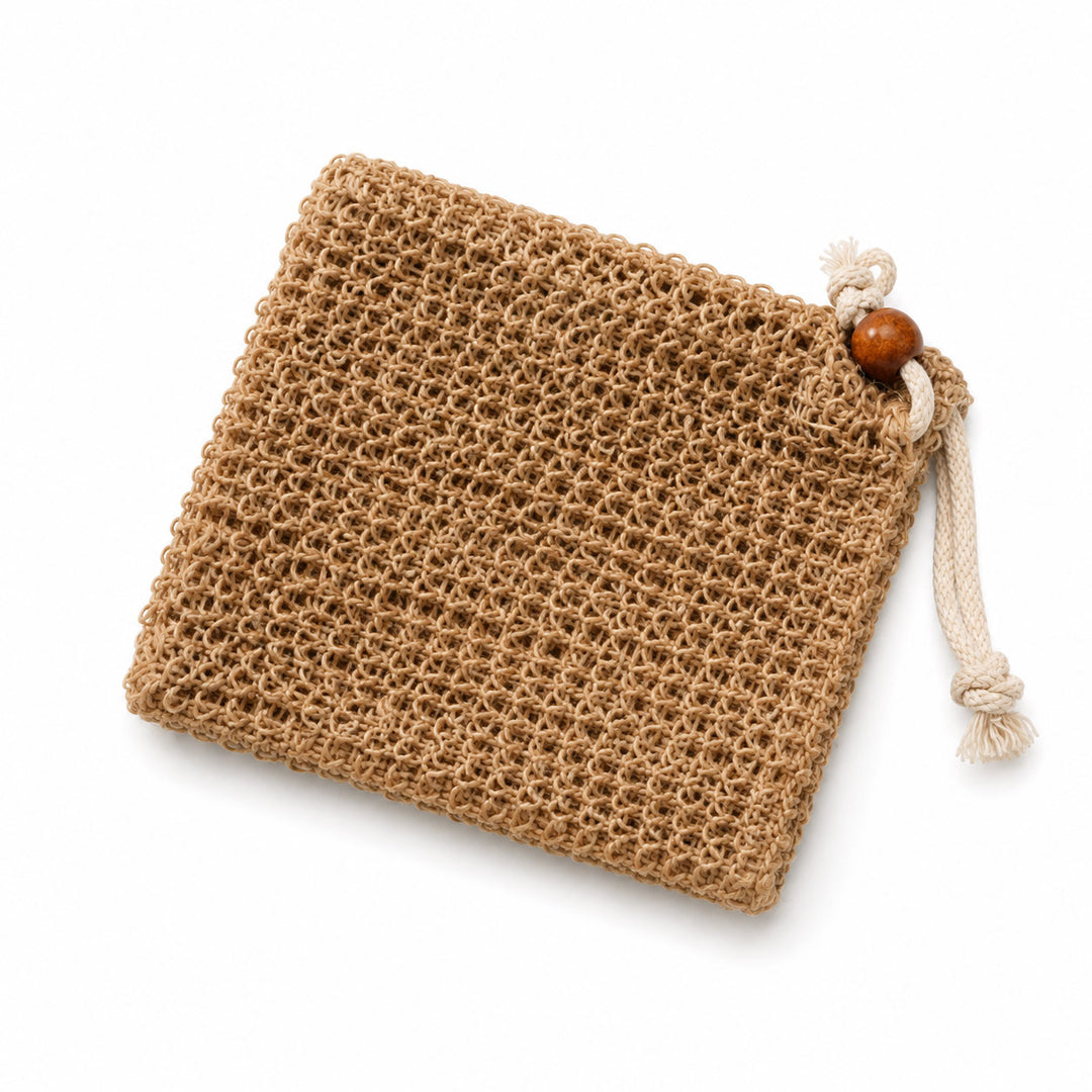 A square woven natural fiber pouch in a light brown jute or burlap material, featuring a cream-colored drawstring closure with a wooden bead accent, shown on a clean white background.