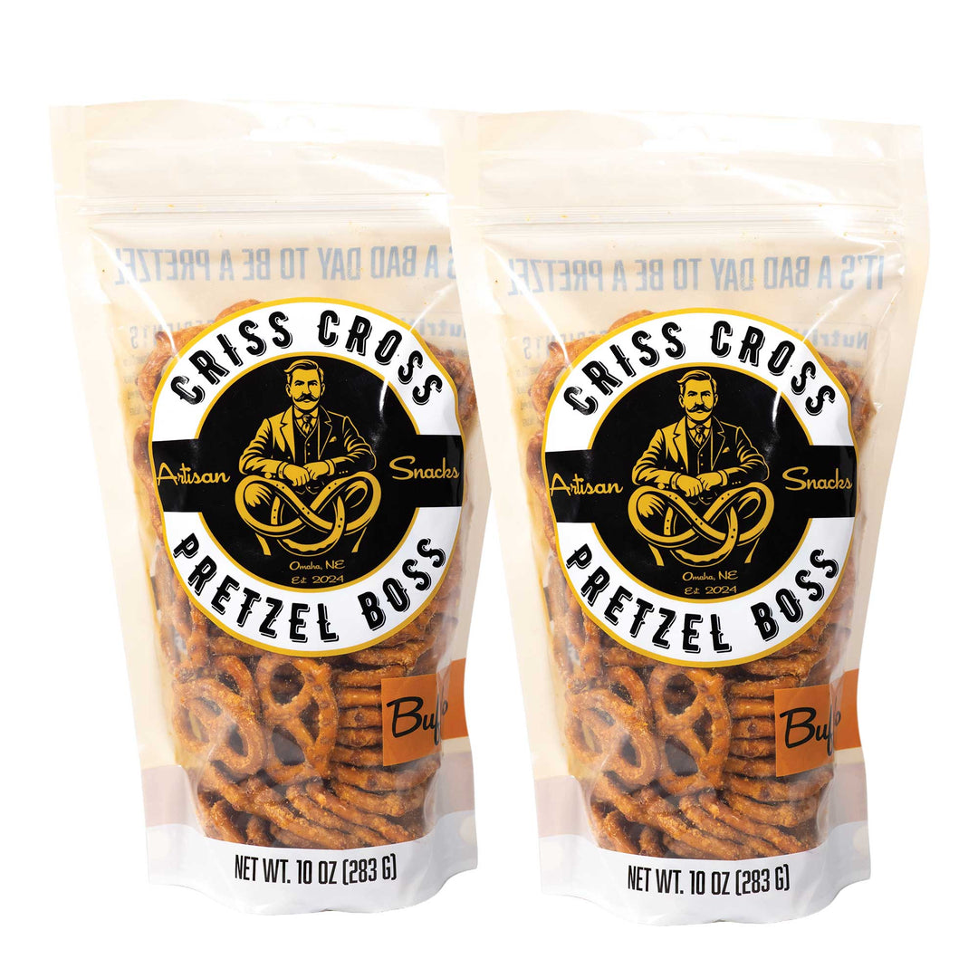 Two packages of Criss Cross Pretzel Boss Buffalo Pretzels on a white background