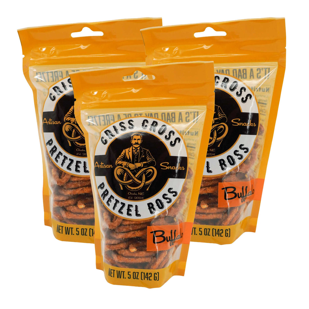 Three packages of Criss Cross Pretzel Boss buffalo pretzels on a white background