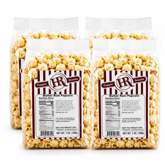 Four clear plastic bags of Poppin' HR Snacks Butter Rum Popcorn arranged in a 2x2 grid on a white background.