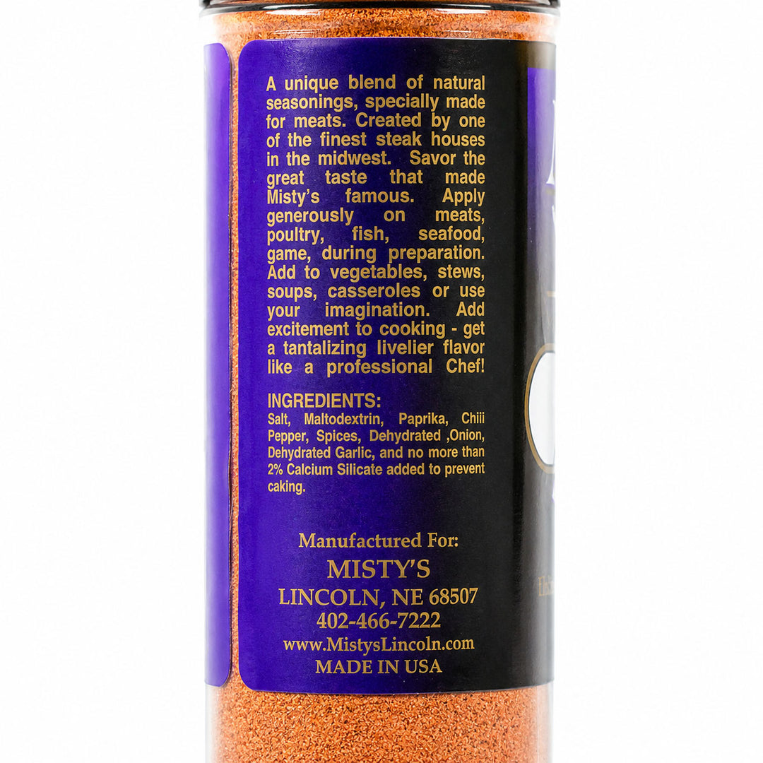 Spice container with purple label and orange spice mix on a white background