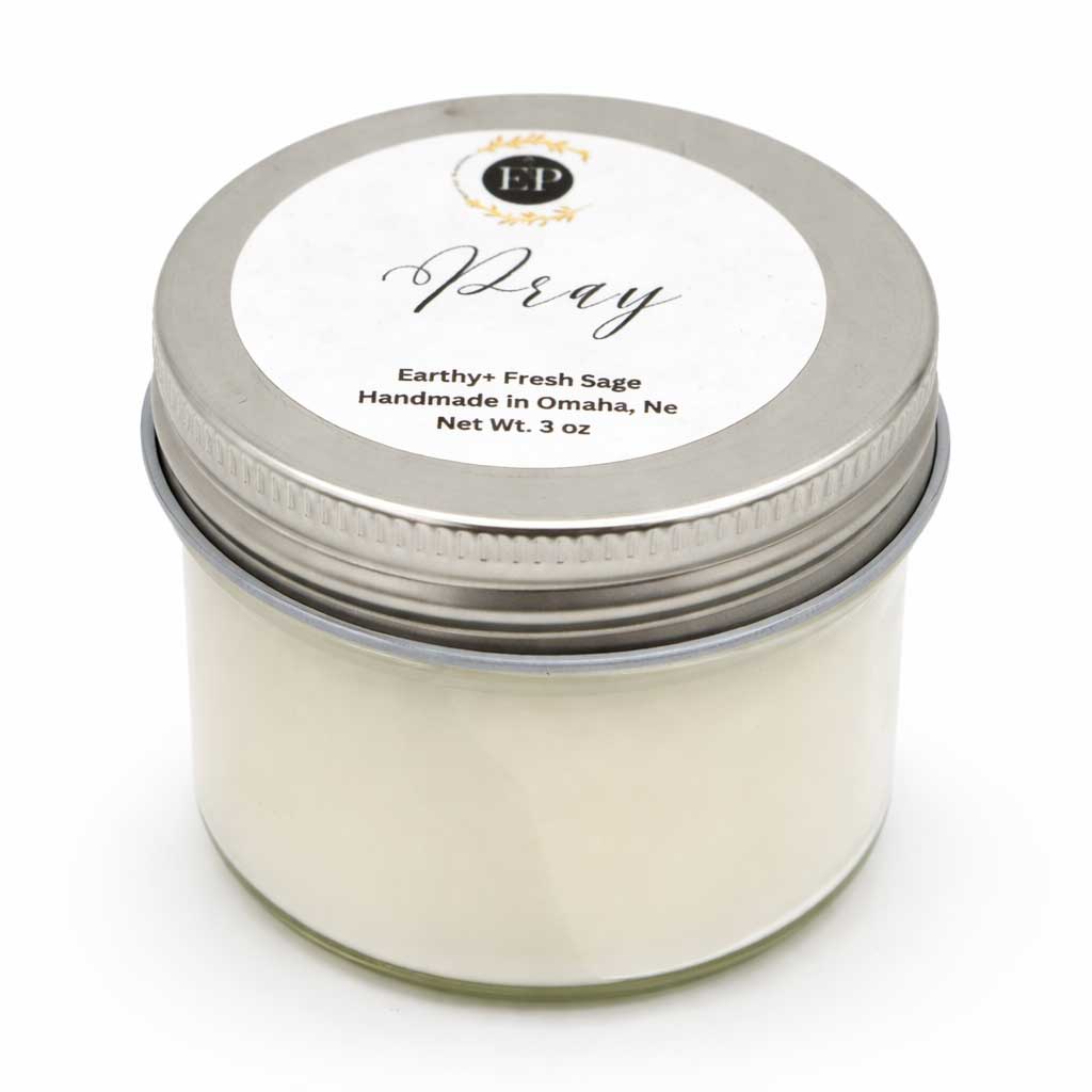 Candle jar with a metal lid on a white background