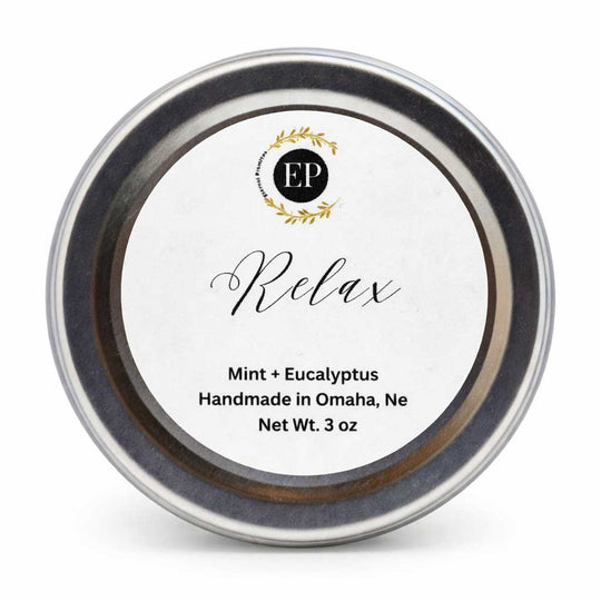 Tin labeled 'Relax' with 'Mint + Eucalyptus' scent, handmade in Omaha, NE.