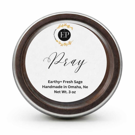 Tin labeled 'Pray' with branding on a white background