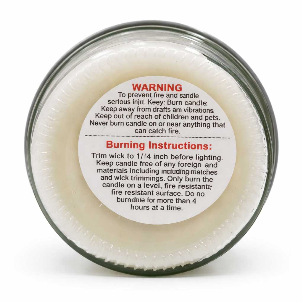 Candle jar with warning label and burning instructions on a white background