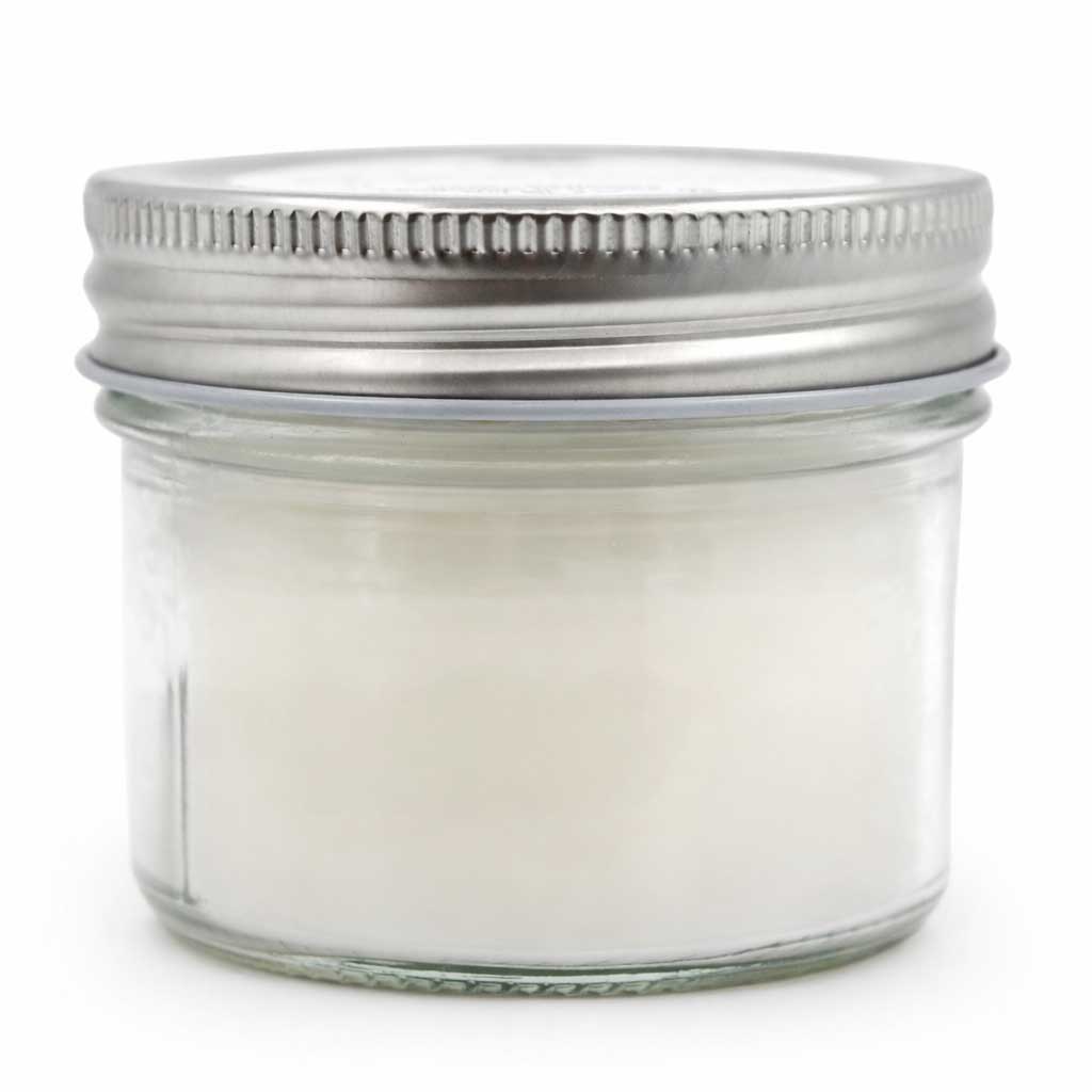 Clear glass jar with metal lid on a white background