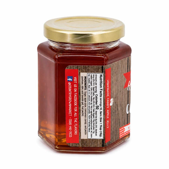 Jar of honey with a wooden-textured label on a white background