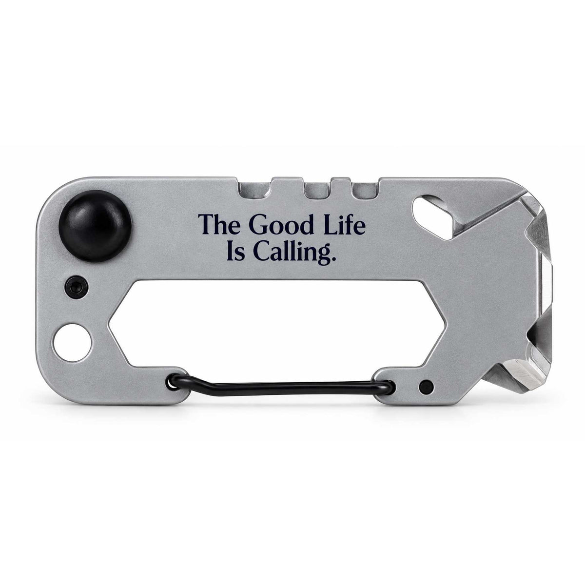 A silver multi-tool card with black accents, featuring the engraved text 'The Good Life Is Calling.' and a black carabiner clip, shown on a white background.