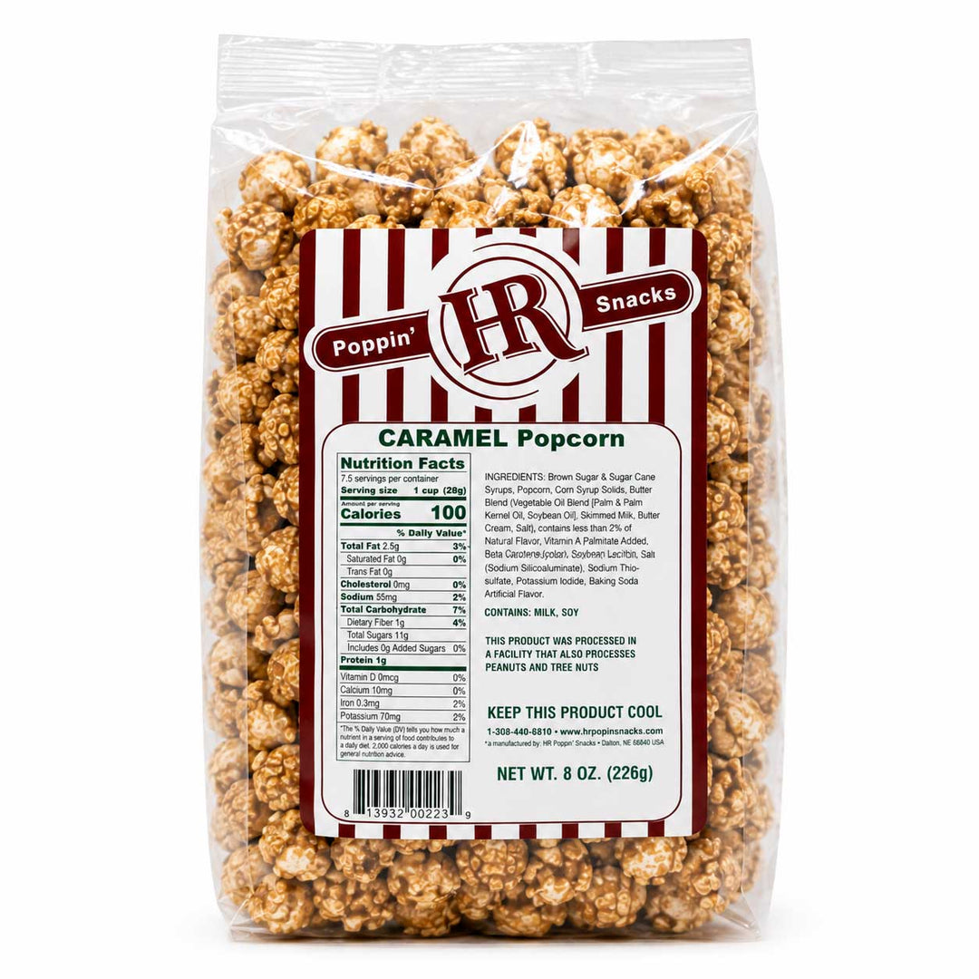 A 8 oz bag of Poppin' HR Snacks Caramel Popcorn in a clear plastic bag with a white and red striped label, set against a plain white background.