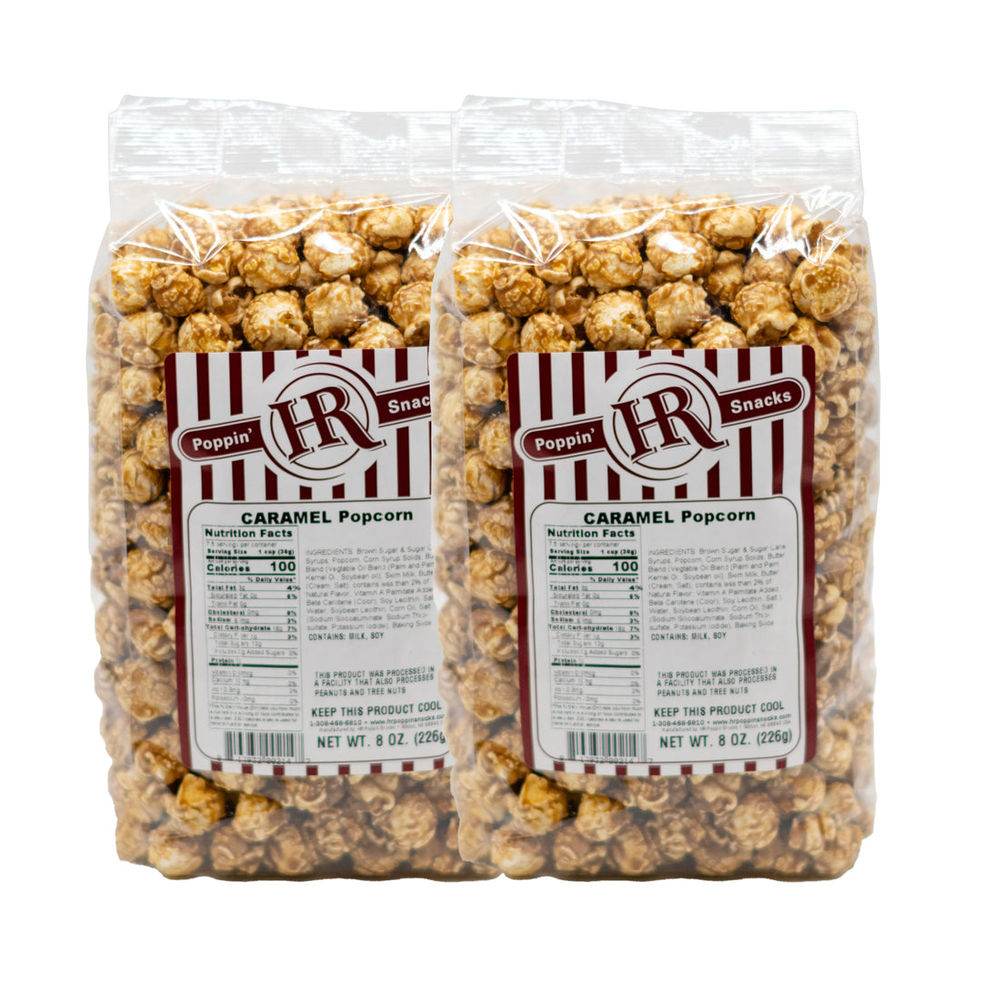 Two packages of caramel popcorn with labels on a white background