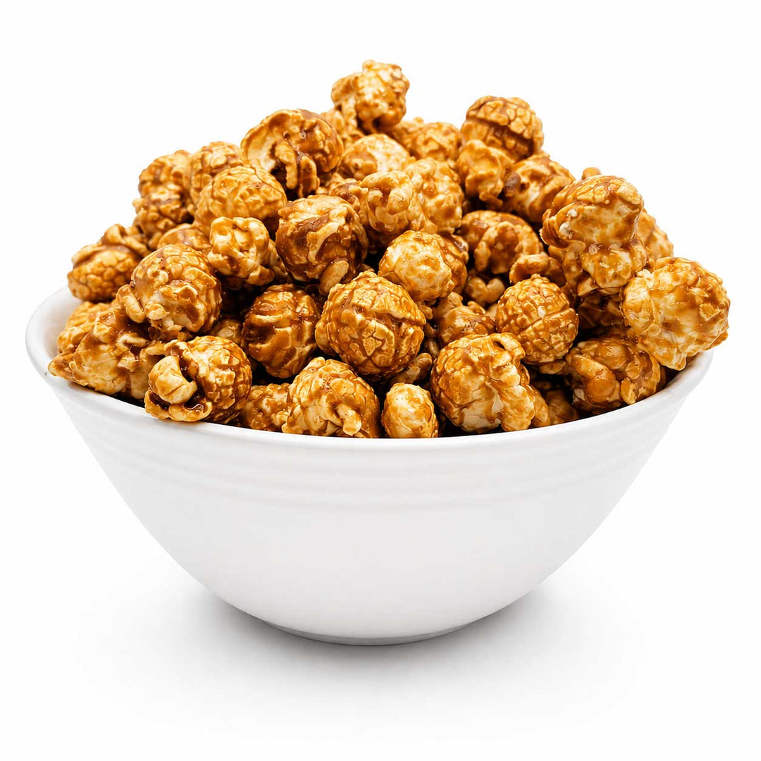 A white ceramic bowl filled with caramel popcorn on a clean white background.