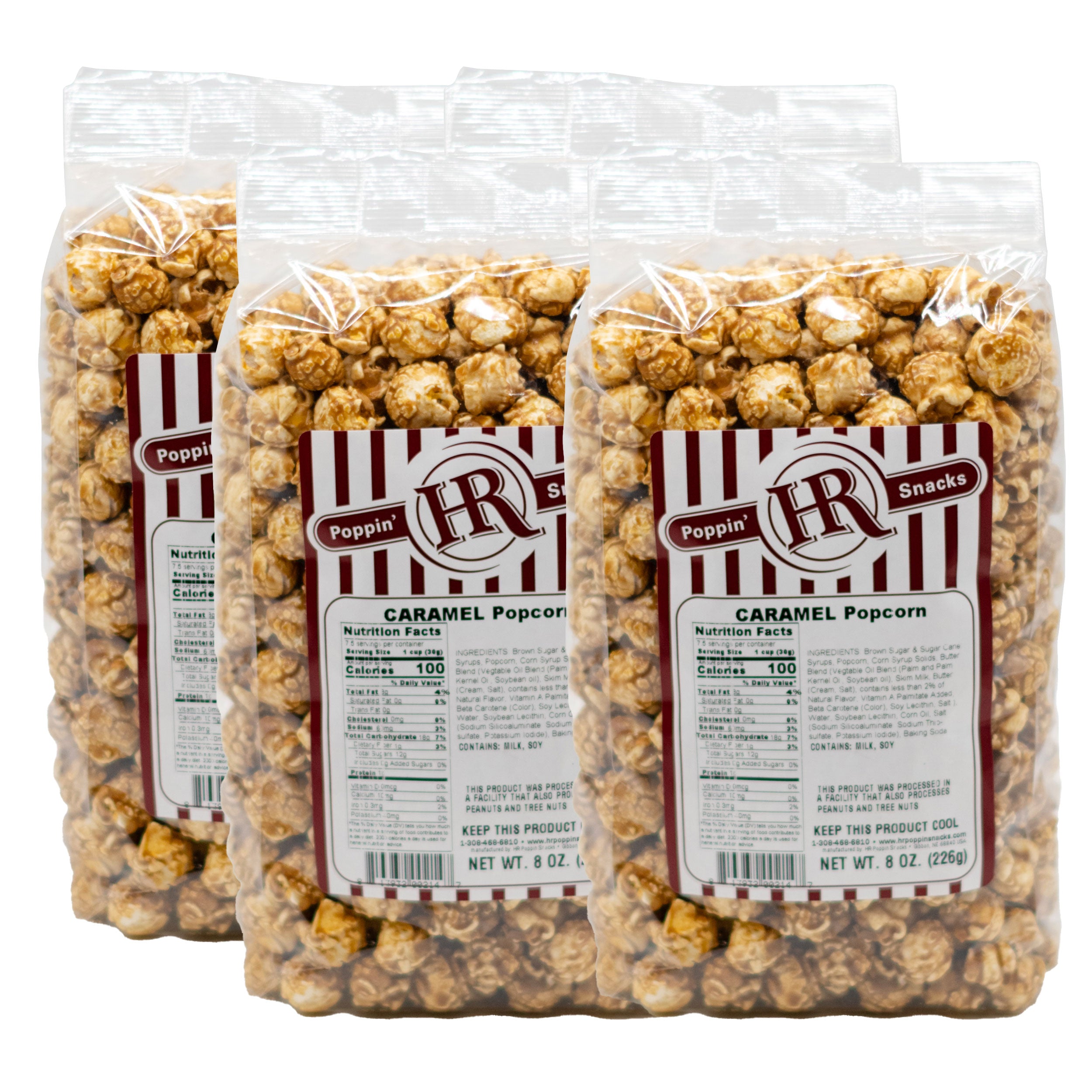 Four packages of caramel popcorn with labels on a white background