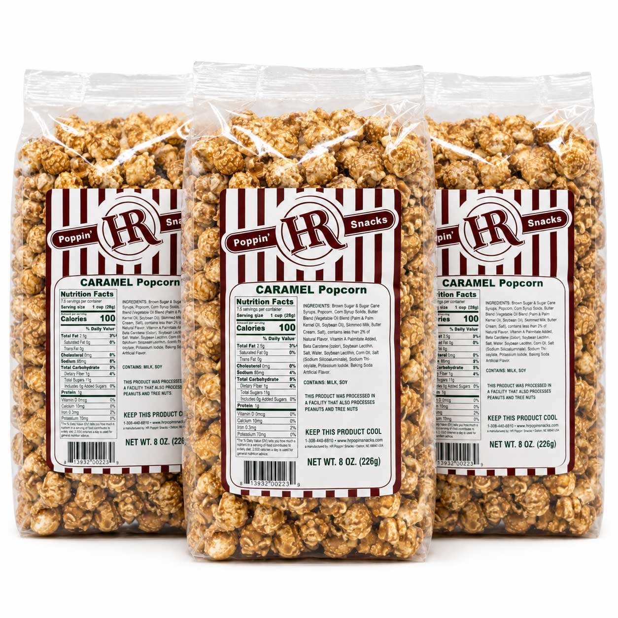 Three clear plastic bags of Pepperoni Caramel Popcorn arranged side by side on a white background, showing the product and labels in detail.