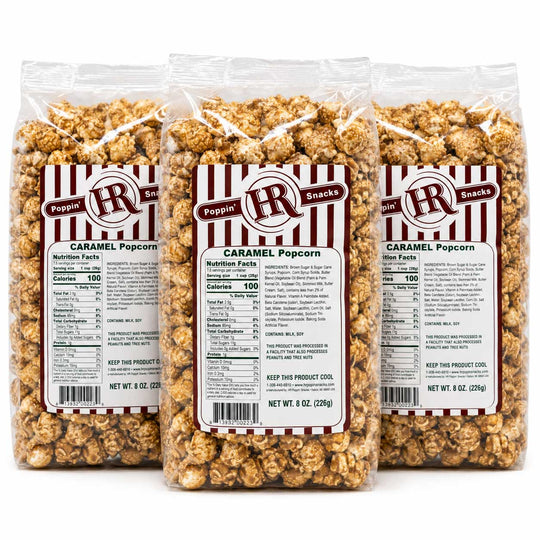 Three clear plastic bags of Pepperoni Caramel Popcorn arranged side by side on a white background, showing the product and labels in detail.