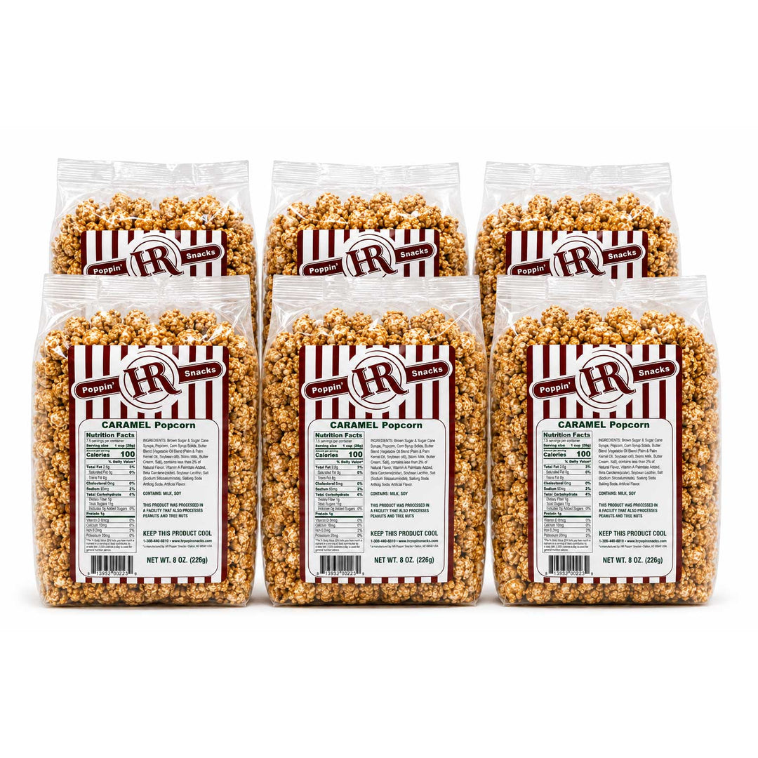 Six clear plastic bags of Pepper Jack Ranch Caramel Popcorn arranged in two rows of three on a white background.