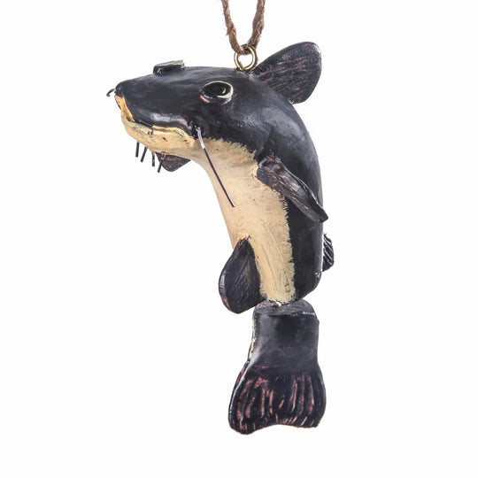 Decorative fish ornament with black and beige colors on a white background