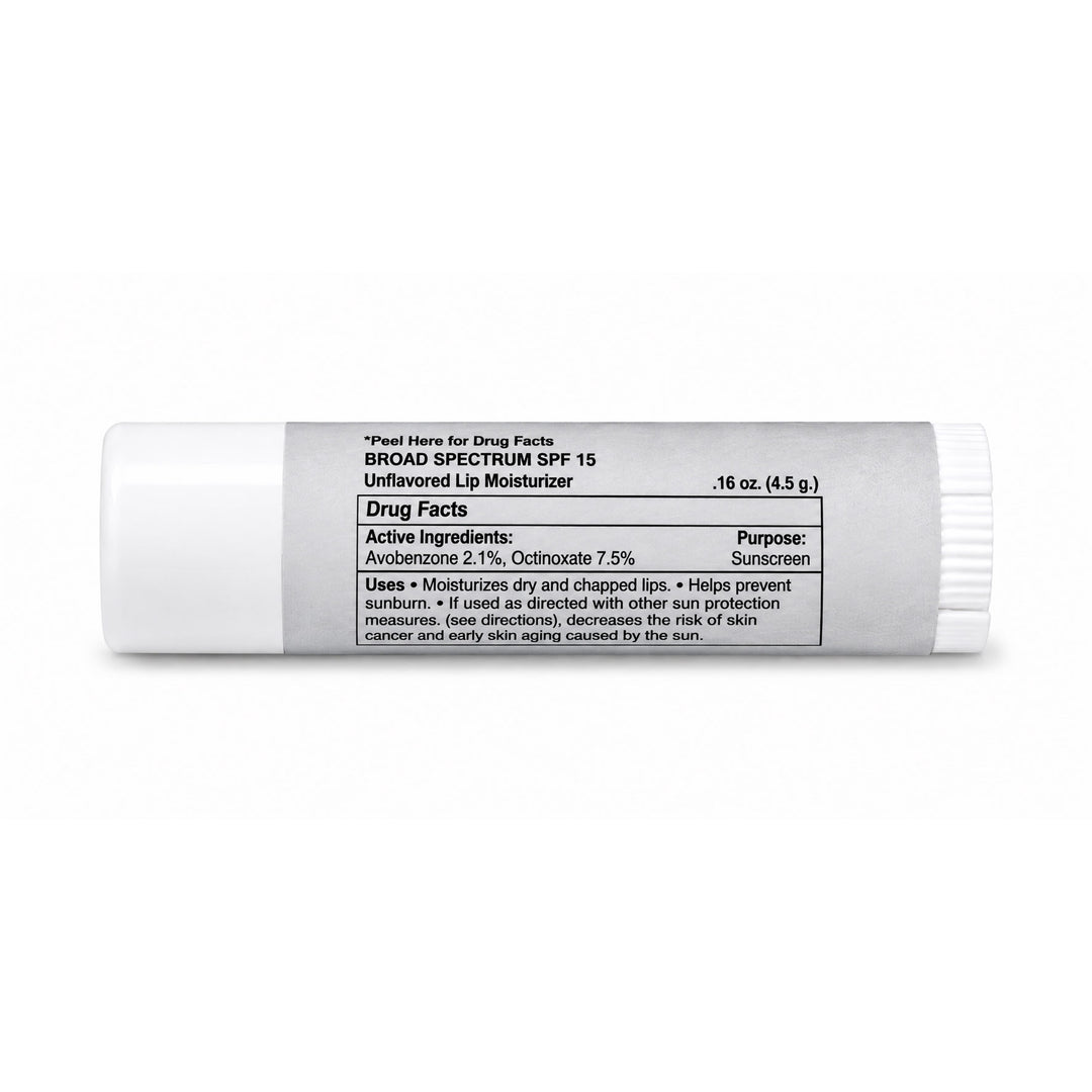 A white plastic tube of Broad Spectrum SPF 15 Unflavored Lip Moisturizer with a black printed Drug Facts label, shown on a clean white background.