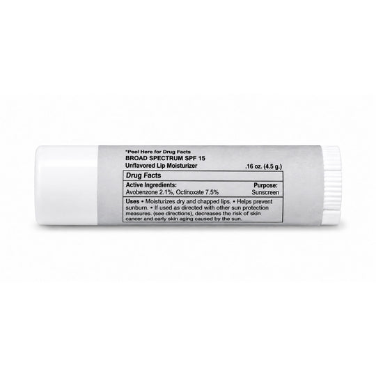 A white plastic tube of Broad Spectrum SPF 15 Unflavored Lip Moisturizer with a black printed Drug Facts label, shown on a clean white background.