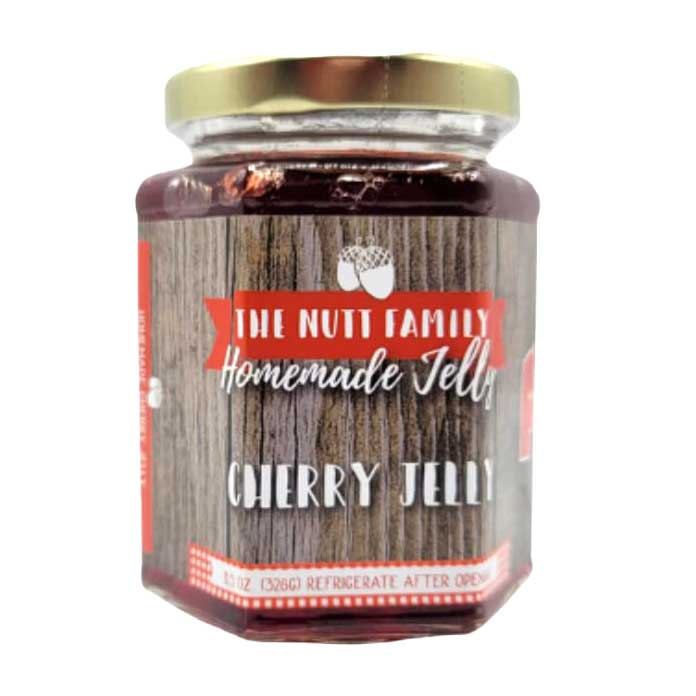 Jar of cherry jelly with a red label on a white background