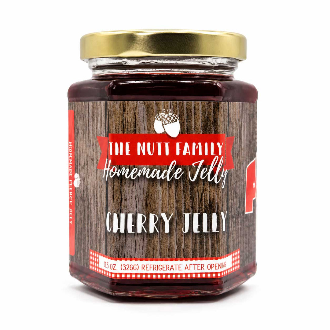 Jar of cherry jelly with a wooden label on a white background