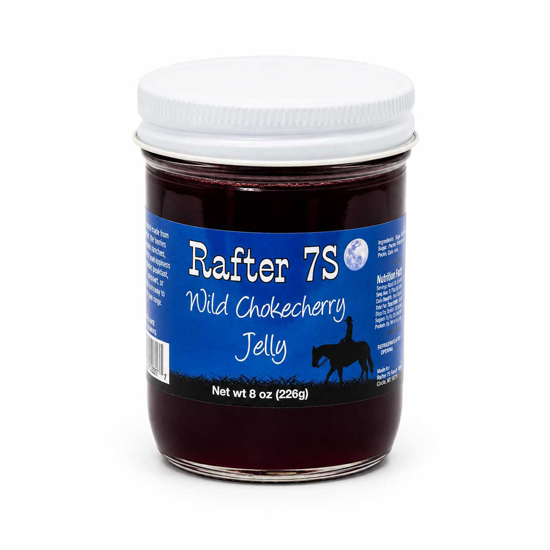 Jar of Rafter 7S Wild Chokecherry Jelly with a blue label on a white background