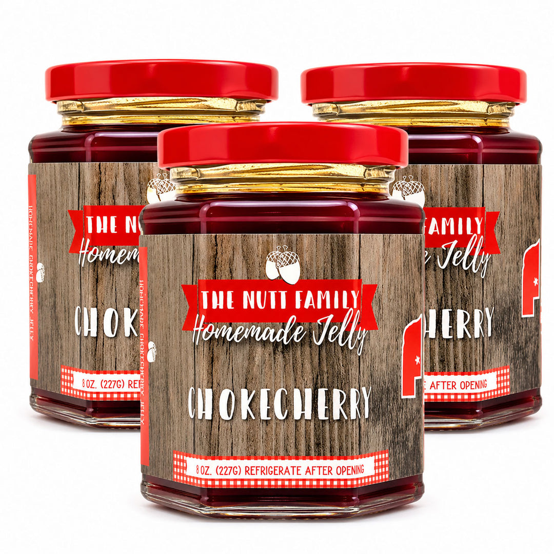 Three jars of 'The Nutt Family Homemade Jelly' Chokecherry on a white background