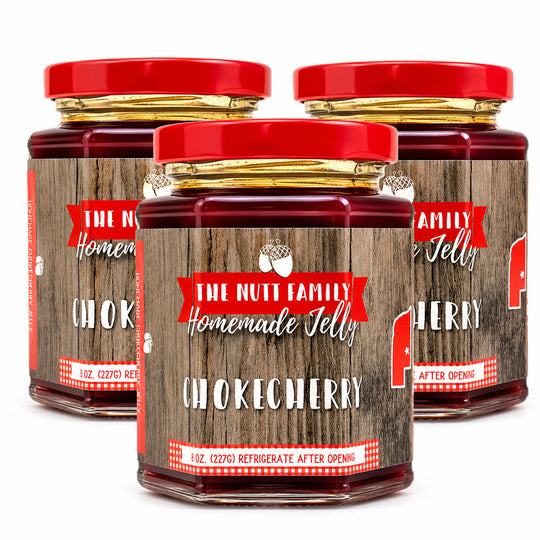 Three jars of 'The Nutt Family Homemade Jelly' Chokecherry on a white background