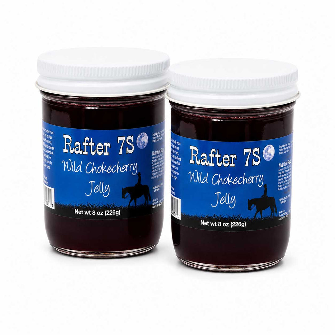 Two jars of Rafter 7S Wild Chokecherry Jelly on a white background