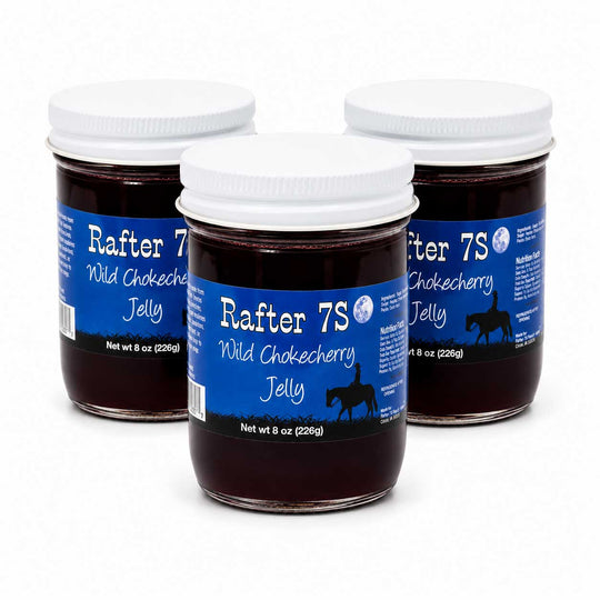 Three jars of Rafter 7S Wild Chokecherry Jelly on a white background