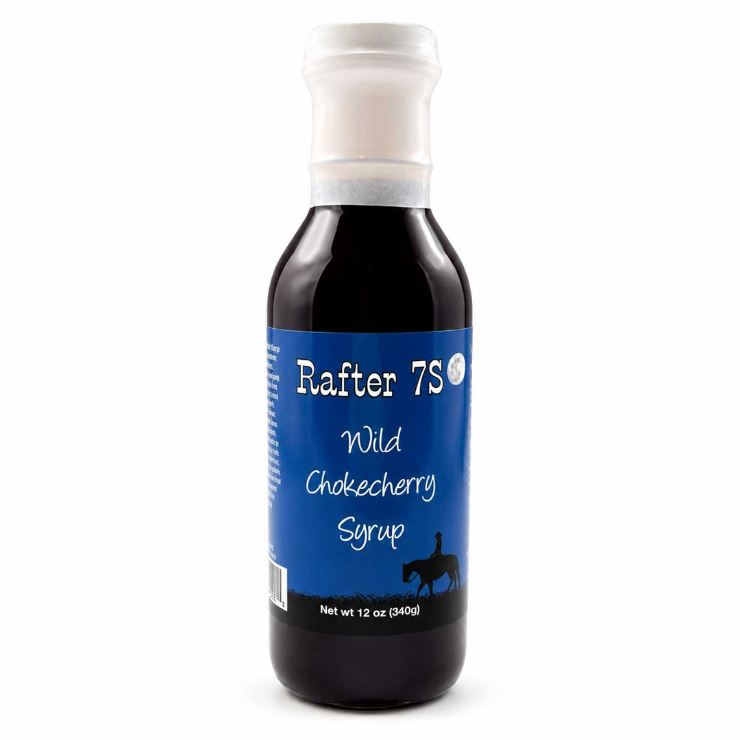 Bottle of Rafter 7S Wild Chokecherry Syrup on a white background