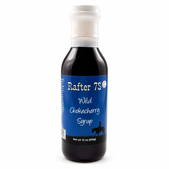 Bottle of Rafter 7S Wild Chokecherry Syrup on a white background