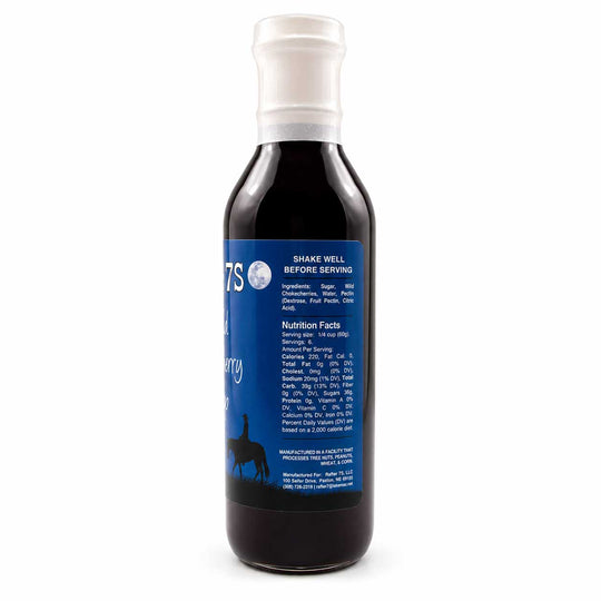 Bottle of 7s syrup with blue label on a white background