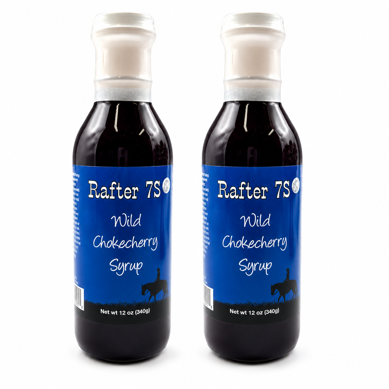 Two bottles of Rafter 7S Wild Chokecherry Syrup on a white background