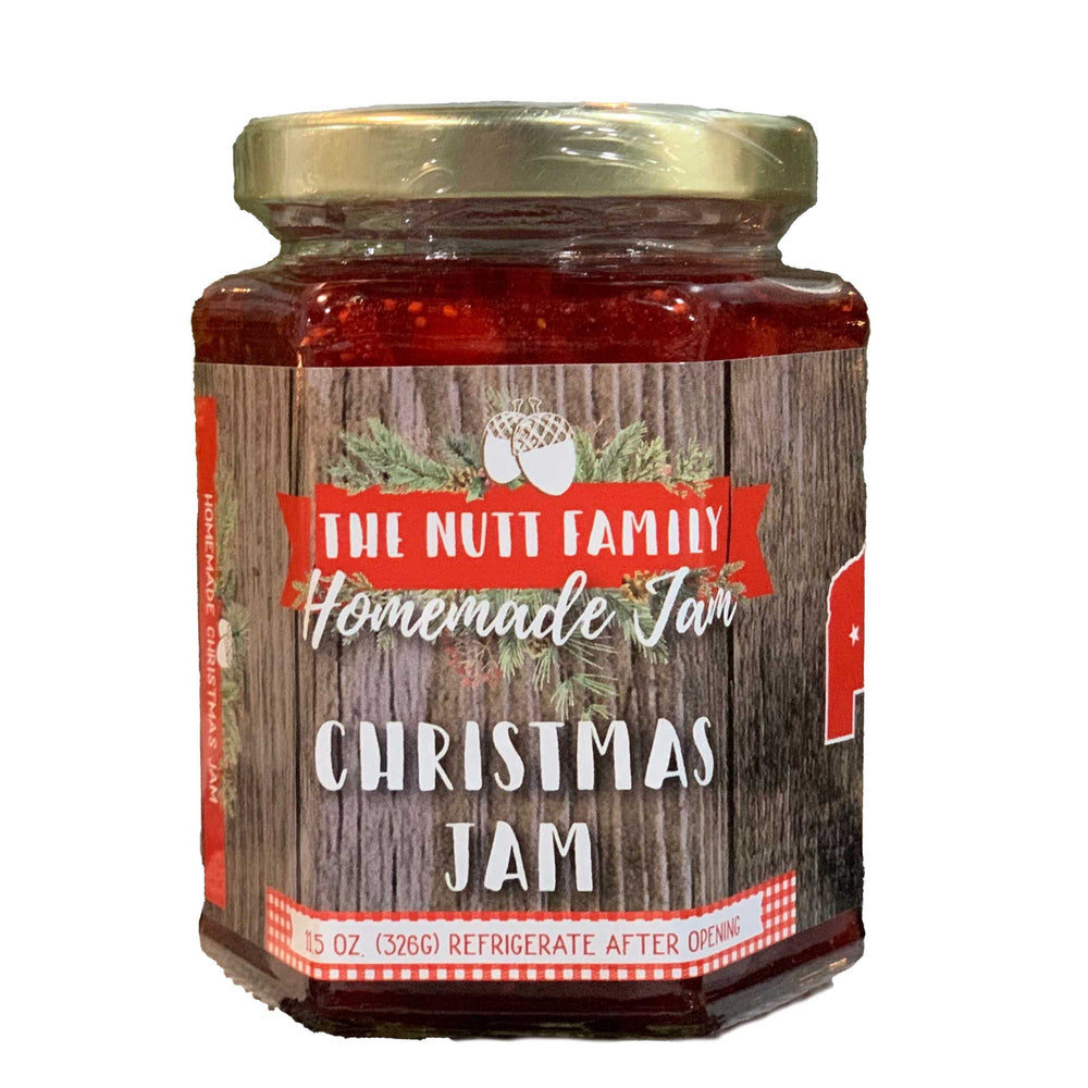 Jar of Christmas Jam with a wooden label on a white background
