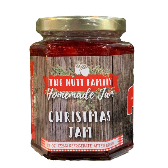Jar of Christmas Jam with a wooden label on a white background