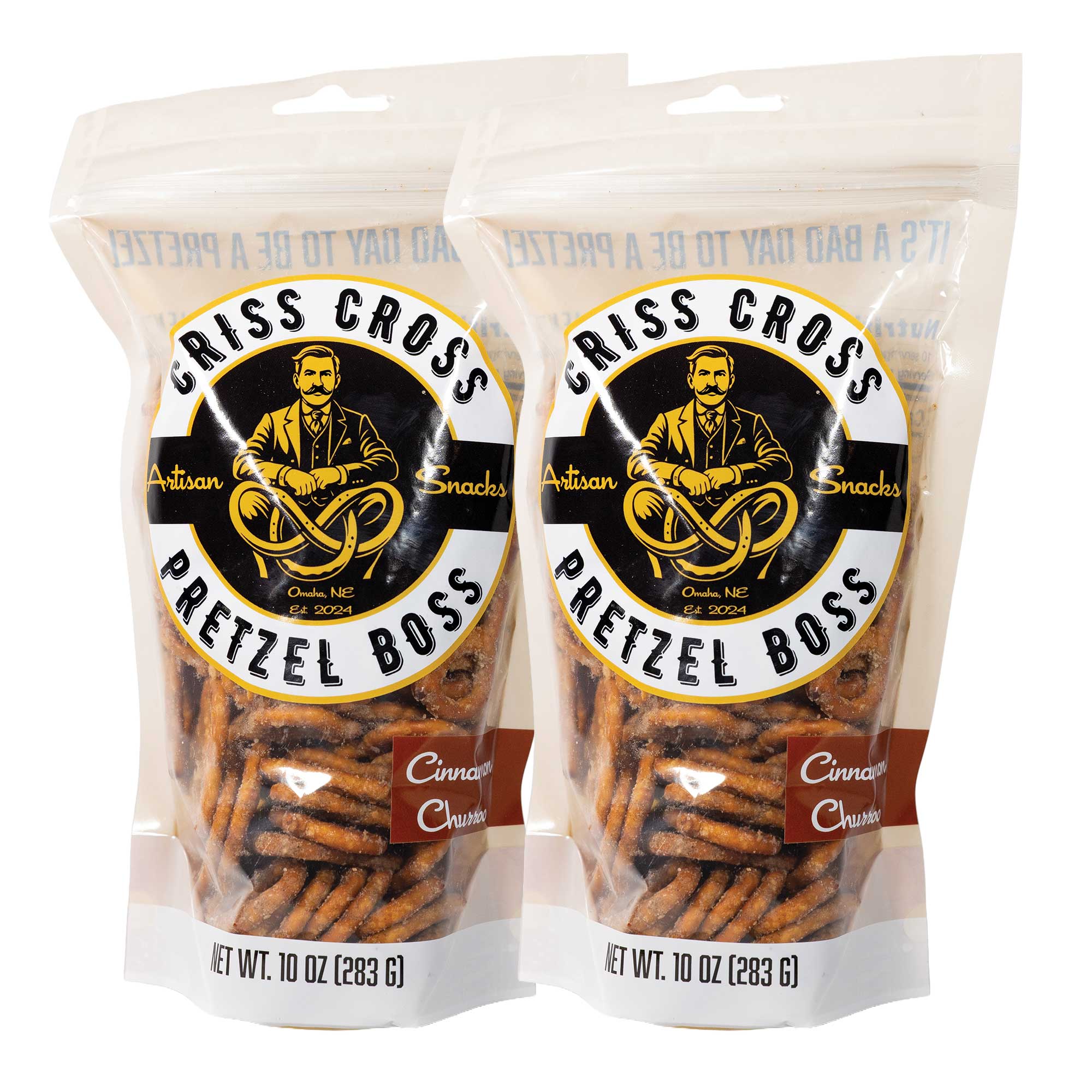 Two packages of Criss Cross Pretzel Boss Cinnamon Churro pretzels on a white background