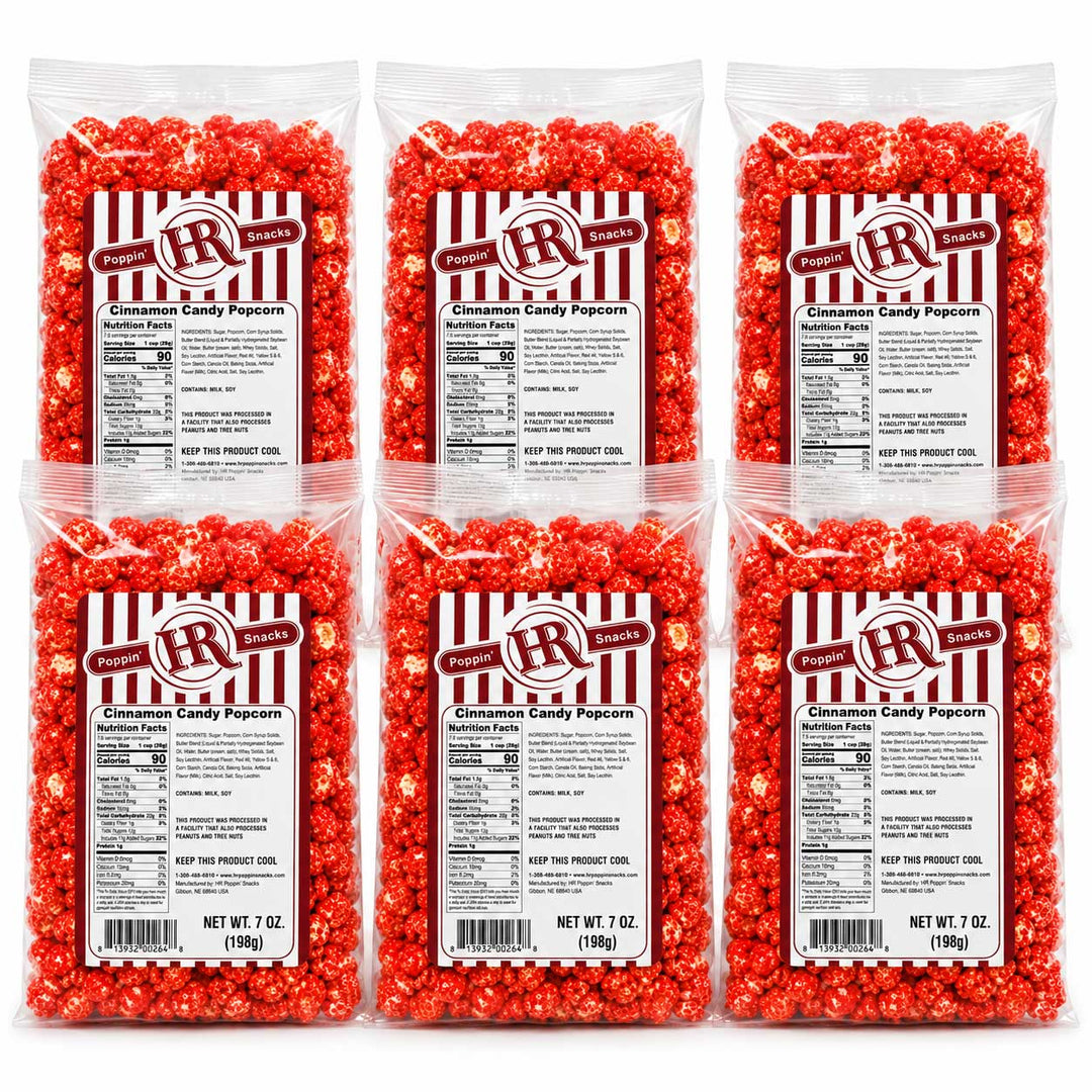 Six clear plastic bags of RR Brand Cinnamon Candy Popcorn arranged in a 2x3 grid on a white background. Each bag contains bright red popcorn coated with cinnamon and sugar, with a white and red striped label showing product details.