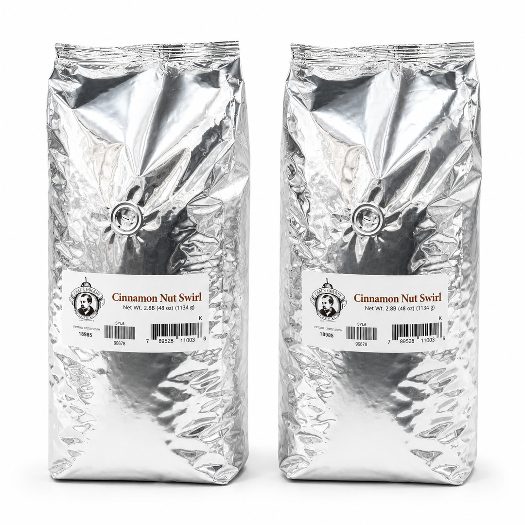 Two packages of Cinnamon Nut Swirl coffee on a white background