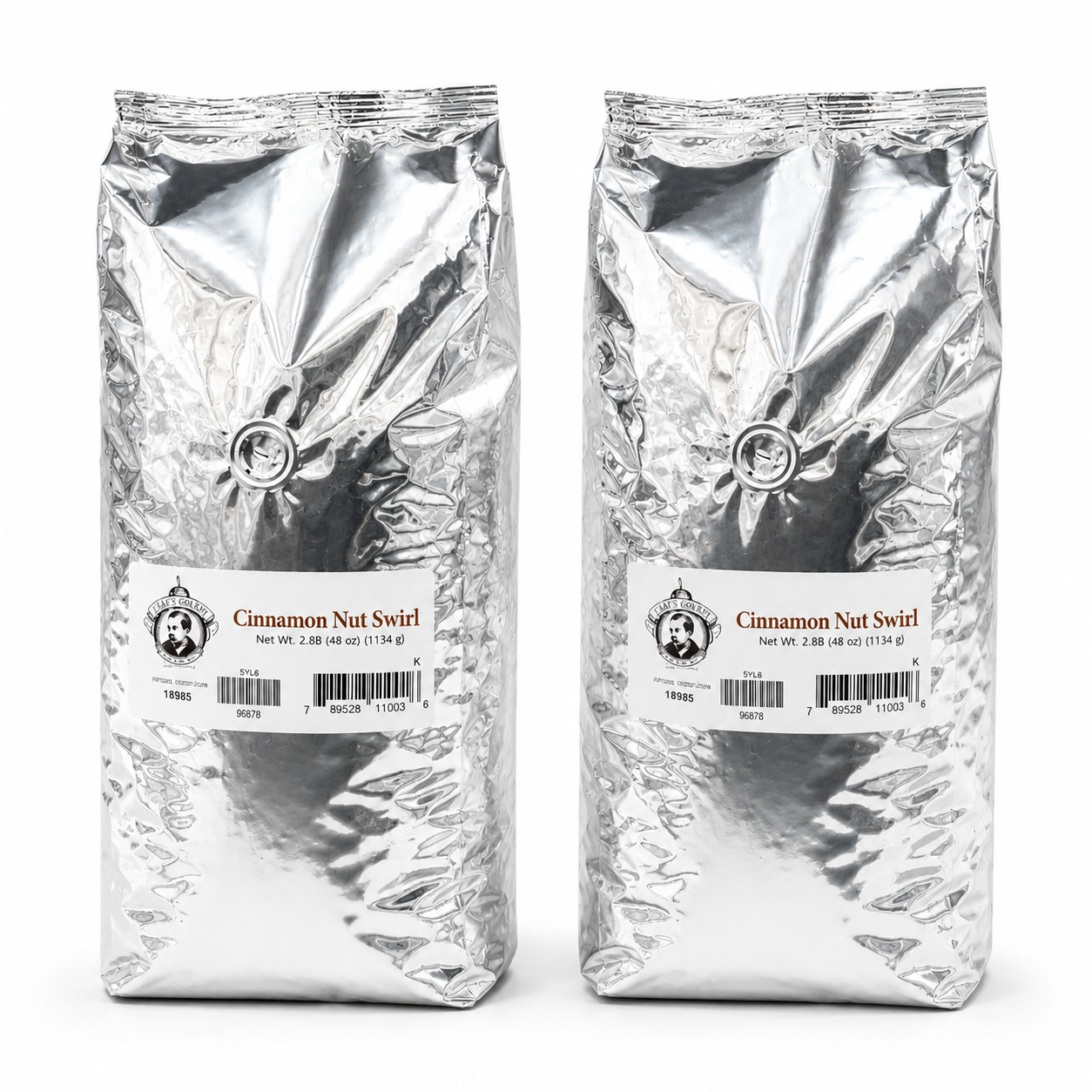 Two packages of Cinnamon Nut Swirl coffee on a white background