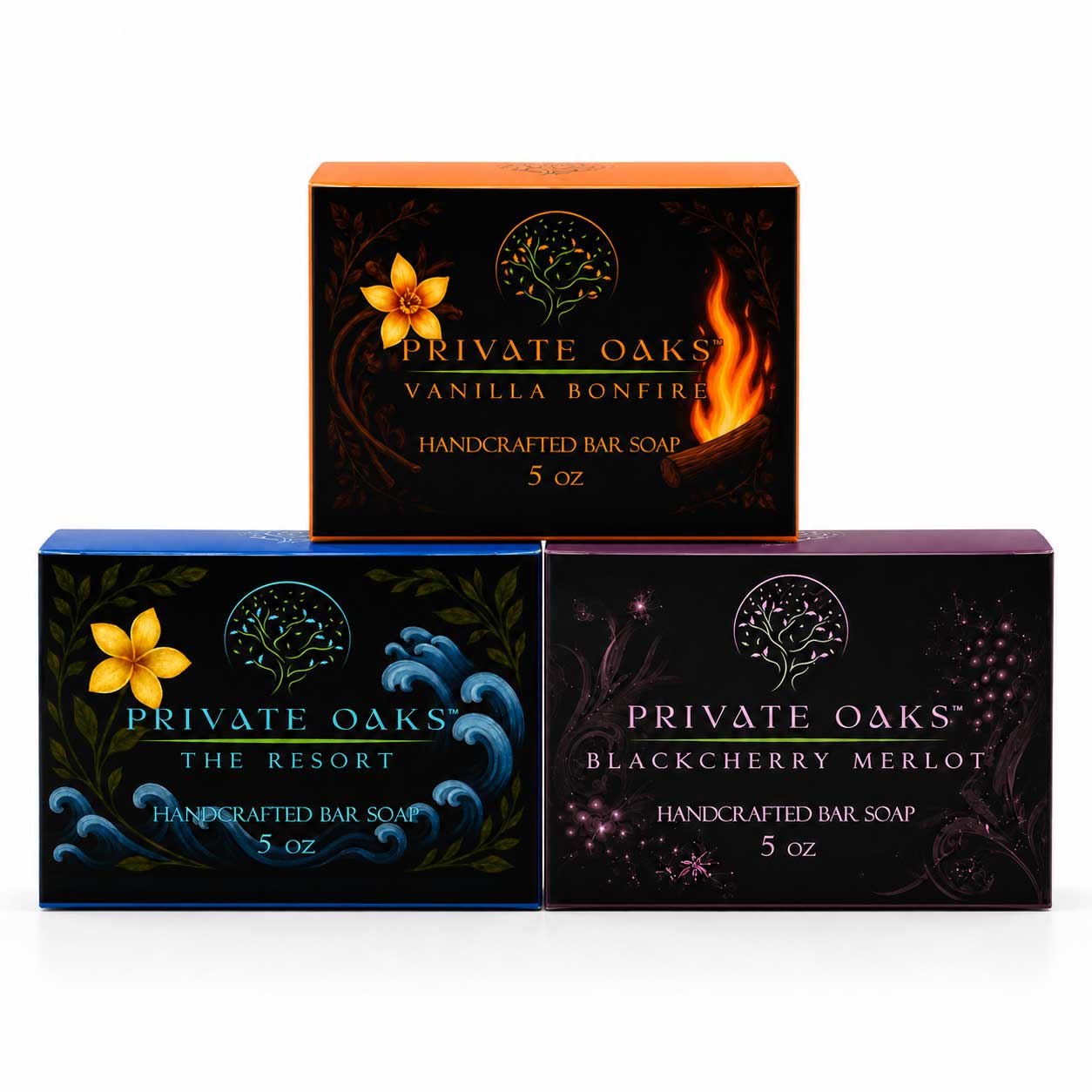 Three boxes of Private Oaks handcrafted bar soap arranged in a pyramid on a white background. The top box is Vanilla Bonfire with orange and black packaging, and the bottom boxes are The Resort Blackberry Merlot with blue and purple packaging.