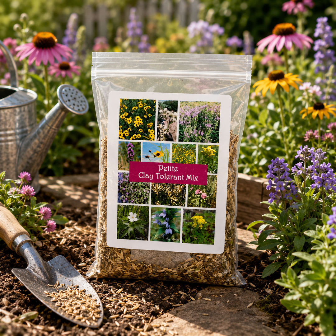 Bag of Petite Clay Tolerant Mix in a garden setting with flowers and gardening tools.