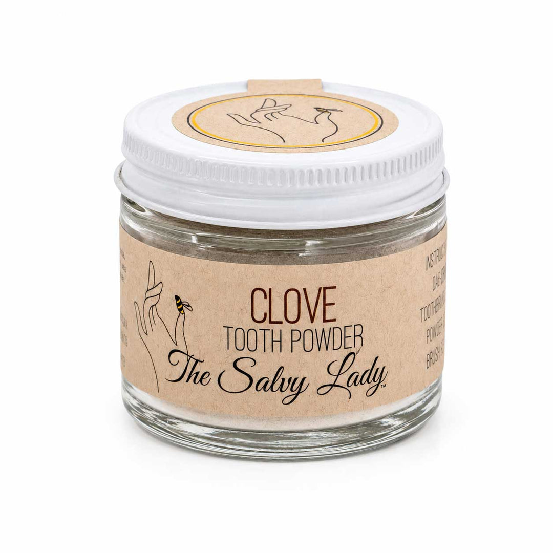 Jar of clove tooth powder labeled 'The Salvy Lady' on a white background
