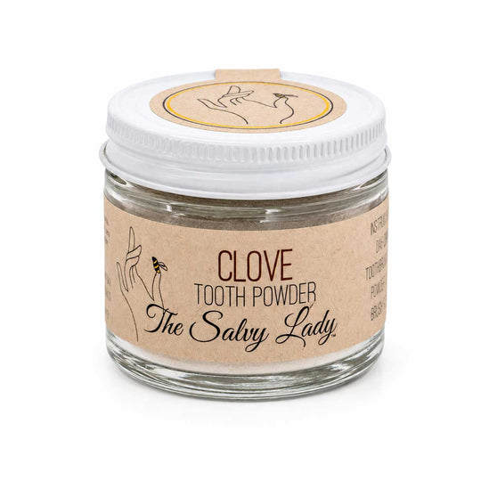 Jar of clove tooth powder labeled 'The Salvy Lady' on a white background