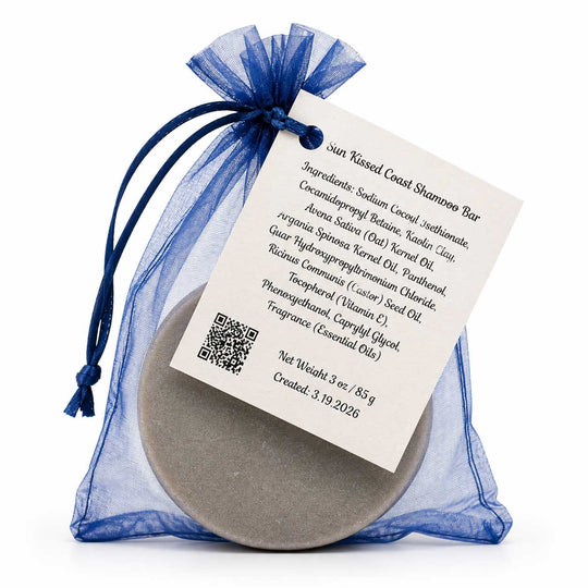 Shampoo bar in a blue drawstring bag with a label on a white background