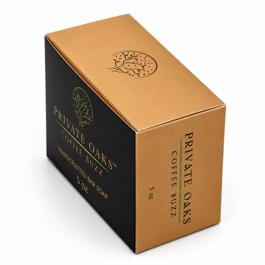 A 5 oz box of Private Oaks Coffee Buzz Handcrafted Bar Soap, featuring a black and metallic gold color scheme with a tree logo.