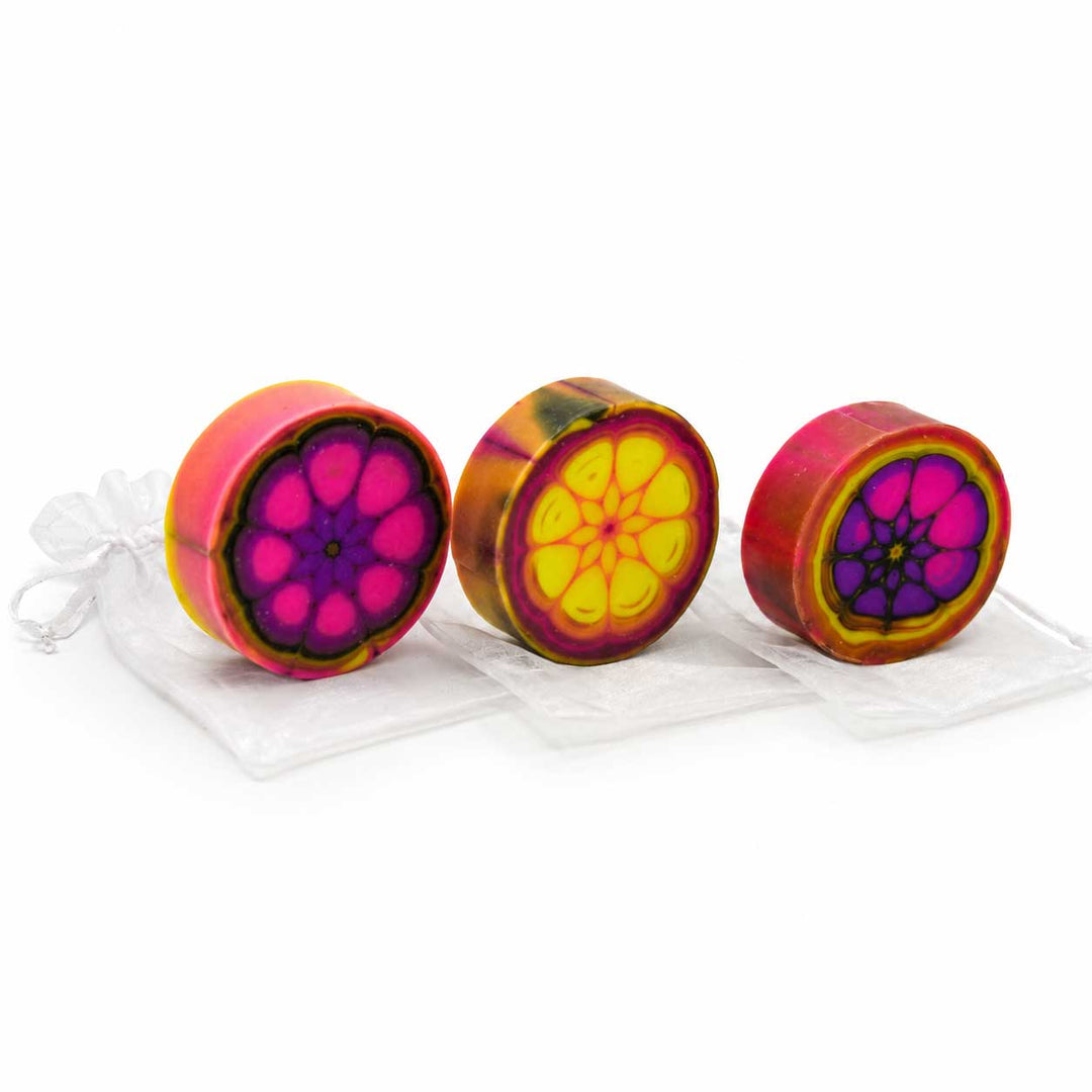 Three colorful wheel-shaped objects with a white background