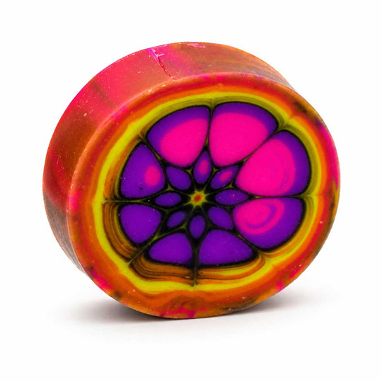 Colorful circular object with a vibrant, multicolored design on a white background