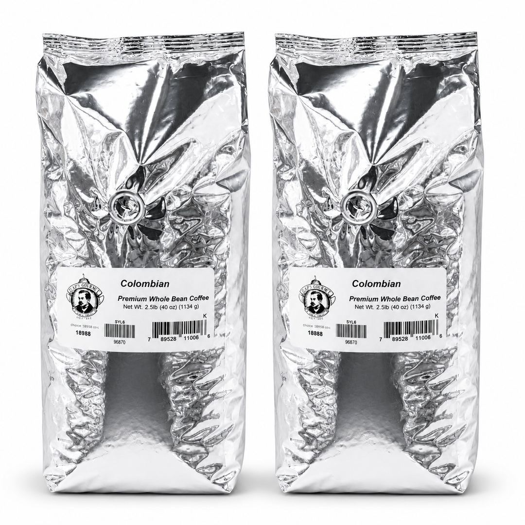 Two packages of Colombian Premium Whole Bean Coffee on a white background